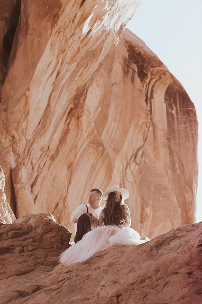 Charlotte Wedding Photography | Bride and Groom sitting on the rocks