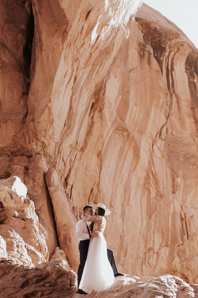Charlotte Wedding Photography | Bride and Groom kissing on the red rocks