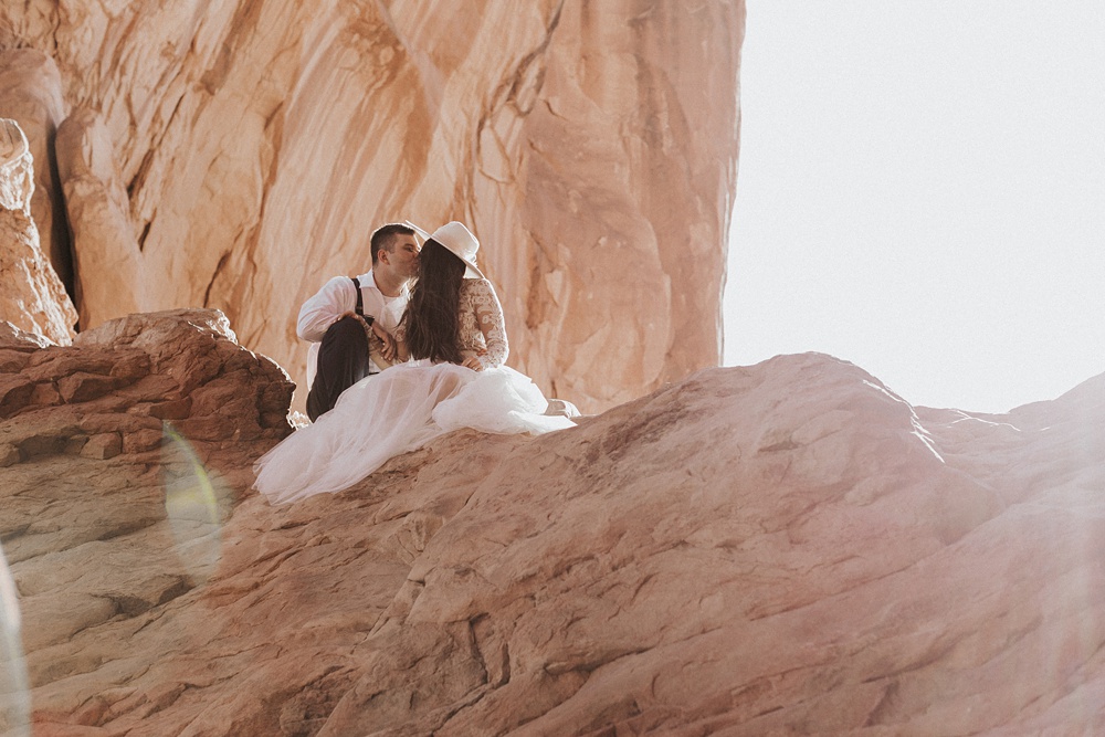 Charlotte Wedding Photography | Kissing at Arches National Park